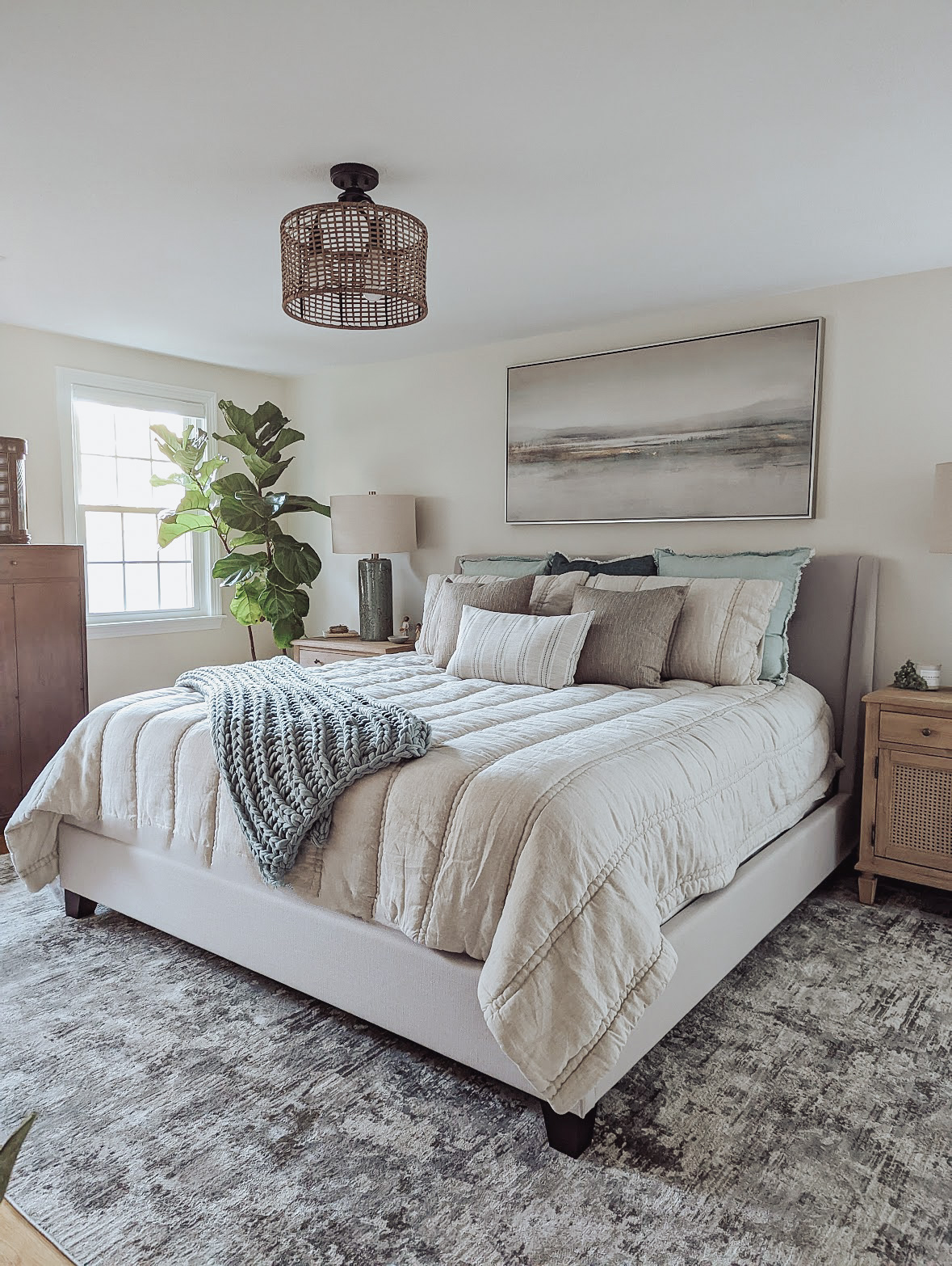 neutral bedroom design with cool toned bedding
