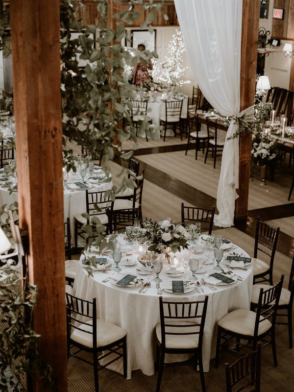 gorgeous wedding table setting and wedding decor in a rustic wedding venue